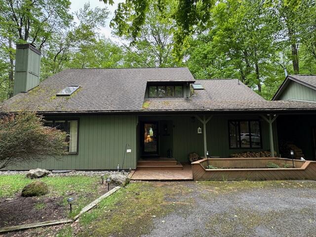122 Sawmill Rd, Pocono Lake, PA 18347 - view of front of property with a porch and a chimney