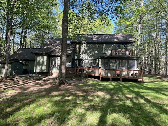 122 Sawmill Rd, Pocono Lake, PA 18347 - rear view of house featuring a storage shed, a wooden deck, and a lawn