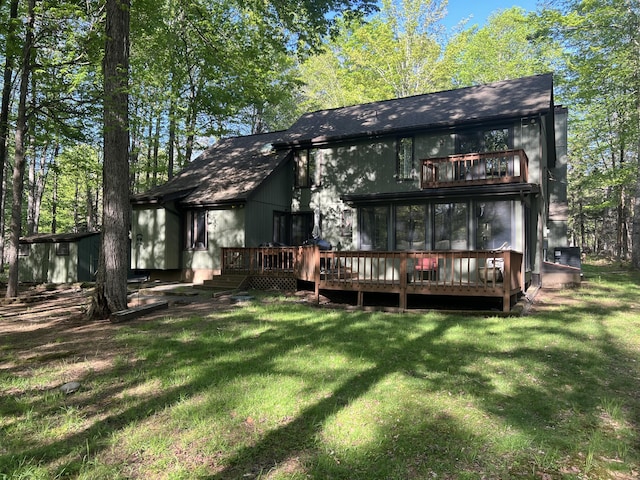 122 Sawmill Rd, Pocono Lake, PA 18347 - rear view of house with a balcony, a yard, and a deck