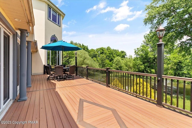 deck with outdoor dining area