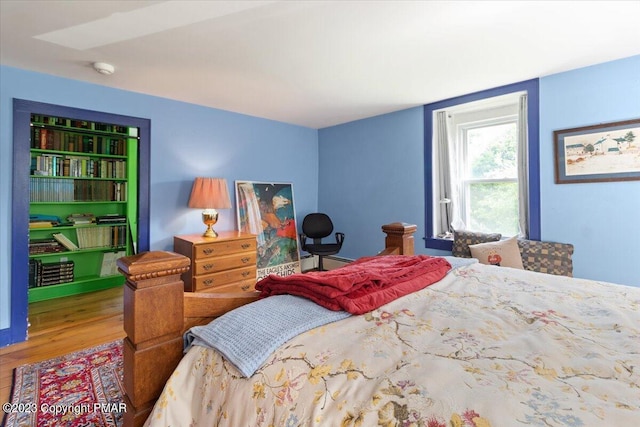 bedroom featuring wood finished floors