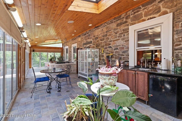 view of patio featuring area for grilling, a sink, and outdoor dining space