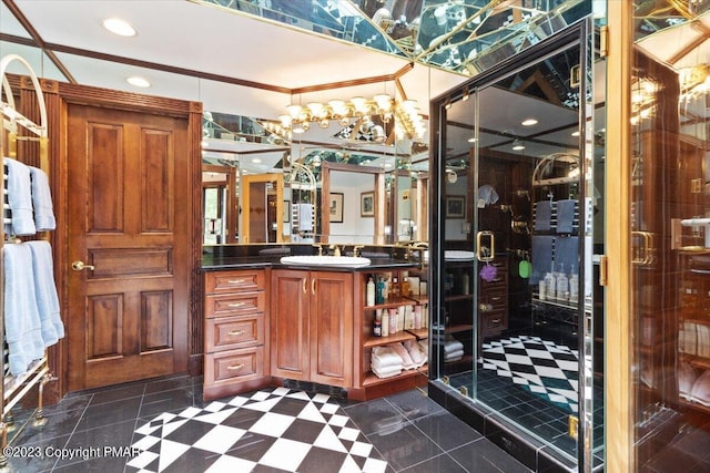 bathroom featuring a shower stall and vanity