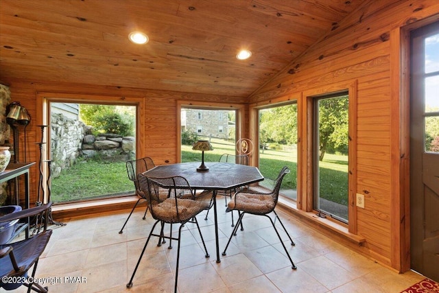 sunroom featuring plenty of natural light, wooden ceiling, and vaulted ceiling