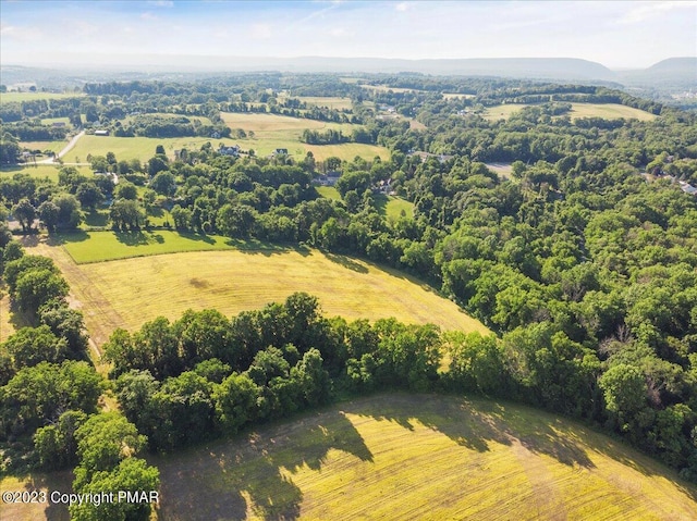 birds eye view of property with a rural view