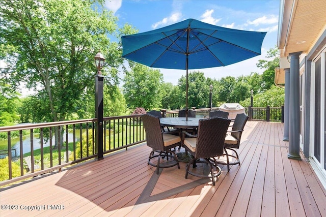 wooden deck with outdoor dining space