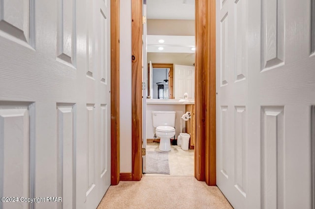 corridor featuring carpet floors