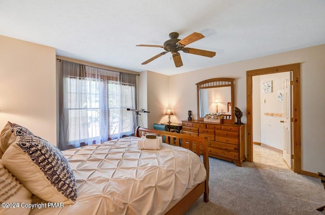 bedroom featuring ceiling fan, carpet flooring, and baseboards