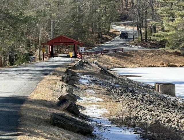 view of street featuring a wooded view