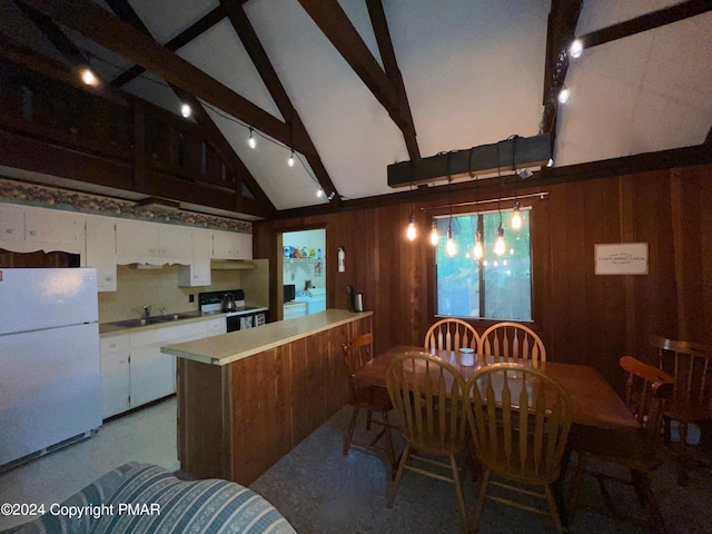 dining area with high vaulted ceiling, beam ceiling, and wood walls