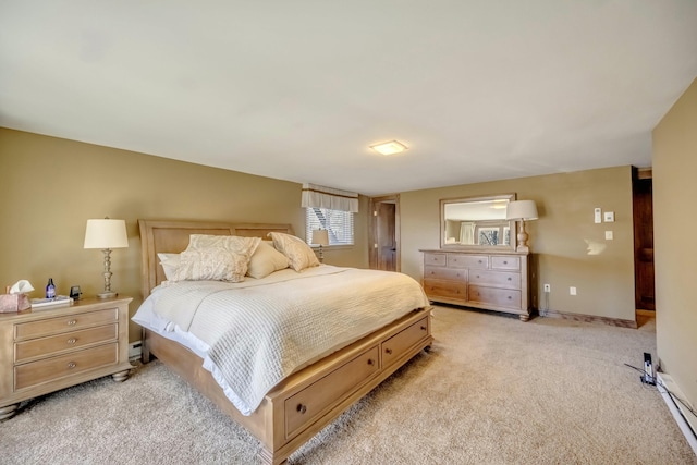 bedroom with light carpet and baseboards