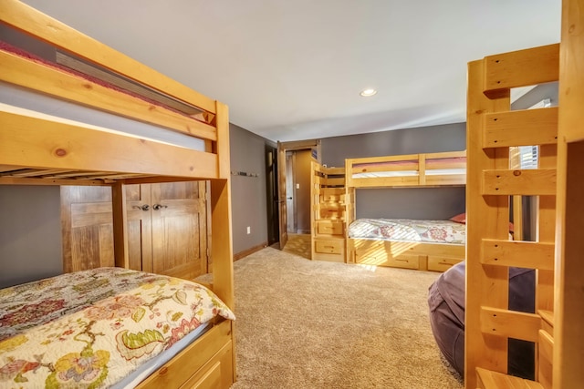 bedroom with carpet floors and recessed lighting