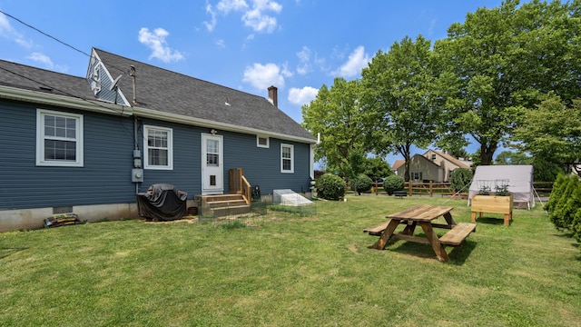 3063 Clearview St, Easton, PA 18045 - rear view of property featuring a lawn, a chimney, and a shingled roof
