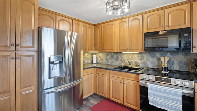 3063 Clearview St, Easton, PA 18045 - kitchen featuring stainless steel appliances, dark countertops, backsplash, and dark wood-style floors