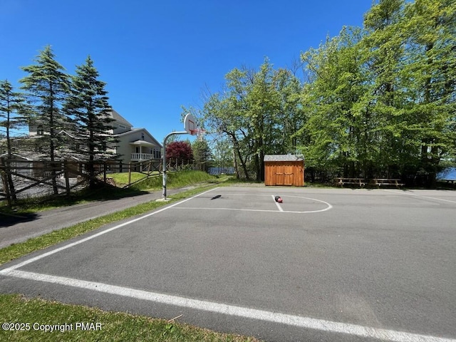 3137 Fern Rd, Pocono Summit, PA 18346 - view of basketball court featuring basketball hoop and a storage shed