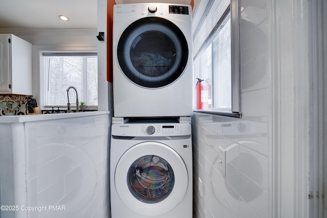 3137 Fern Rd, Pocono Summit, PA 18346 - laundry area with stacked washer / dryer, healthy amount of natural light, and a sink