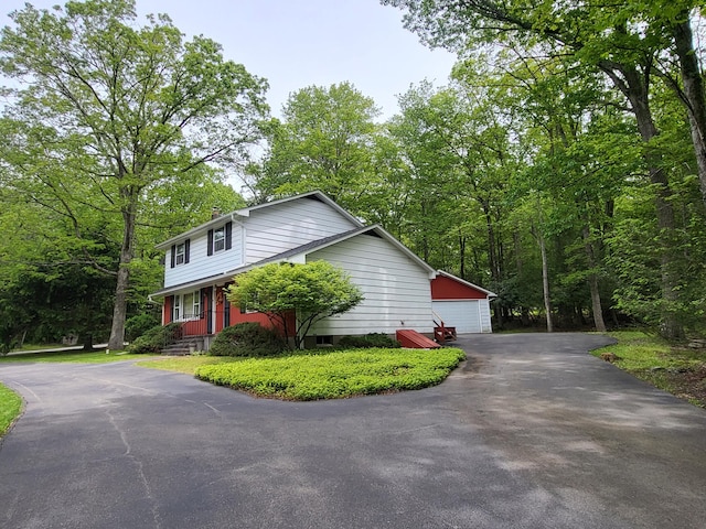 7425 W Dogwood Ln, Cresco, PA 18326 - view of home's exterior featuring a detached garage