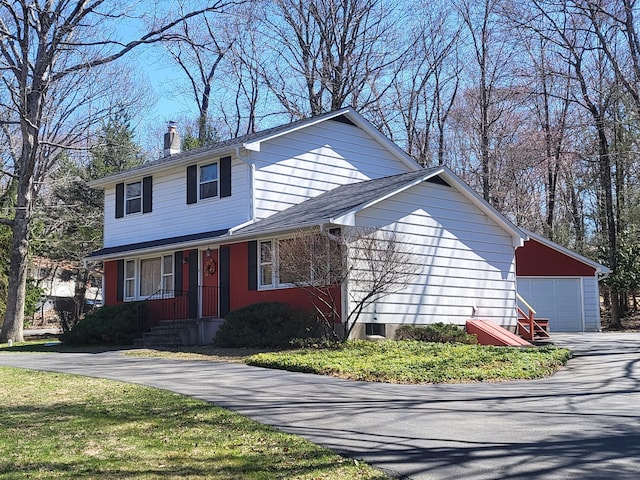7425 W Dogwood Ln, Cresco, PA 18326 - traditional home featuring a garage and a chimney
