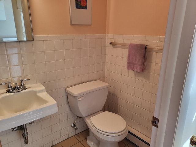 7425 W Dogwood Ln, Cresco, PA 18326 - half bath with a baseboard heating unit, tile walls, toilet, and a sink