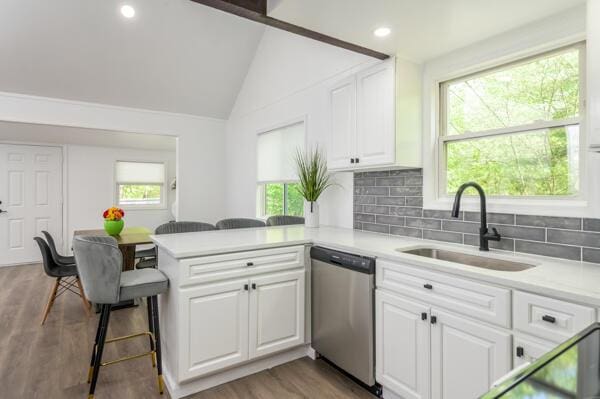 117 Clifton Dr, Bushkill, PA 18324 - kitchen featuring dishwasher, a sink, a peninsula, light countertops, and white cabinetry