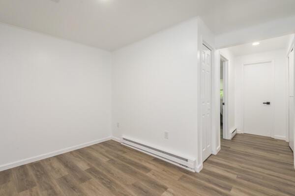 117 Clifton Dr, Bushkill, PA 18324 - unfurnished room featuring baseboard heating, wood finished floors, baseboards, and a baseboard radiator