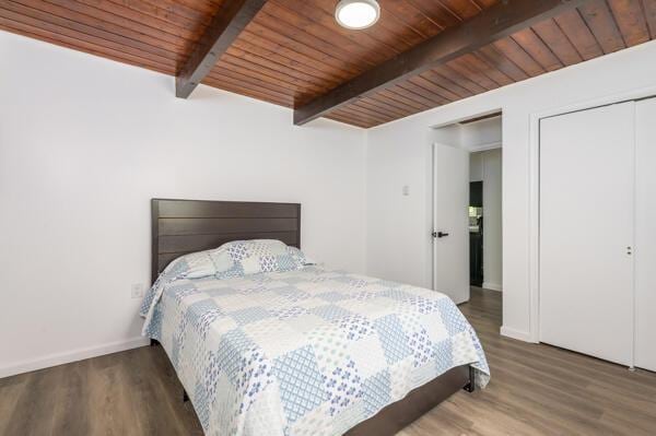 117 Clifton Dr, Bushkill, PA 18324 - bedroom with beam ceiling, wood finished floors, wooden ceiling, baseboards, and a closet