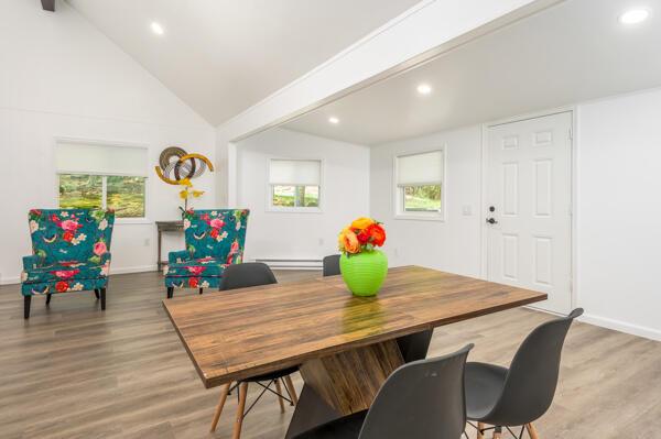 117 Clifton Dr, Bushkill, PA 18324 - dining space featuring baseboard heating, wood finished floors, recessed lighting, lofted ceiling, and baseboards
