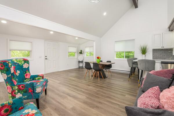 117 Clifton Dr, Bushkill, PA 18324 - living area featuring high vaulted ceiling, beamed ceiling, recessed lighting, light wood-style floors, and baseboards
