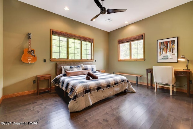 bedroom featuring baseboards, wood finished floors, and recessed lighting