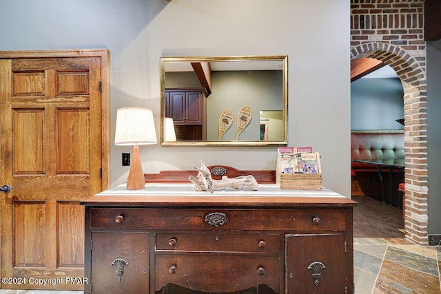 bathroom featuring stone finish floor and vanity