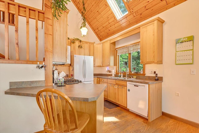 24 Glen Rd, Lake Ariel, PA 18436 - kitchen with white appliances, a sink, light brown cabinetry, lofted ceiling, and a skylight