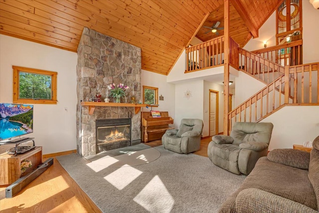 24 Glen Rd, Lake Ariel, PA 18436 - living area featuring wood ceiling, stairs, a stone fireplace, a ceiling fan, and baseboards