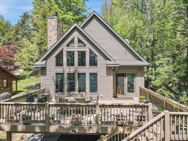24 Glen Rd, Lake Ariel, PA 18436 - rear view of house featuring a deck and a chimney