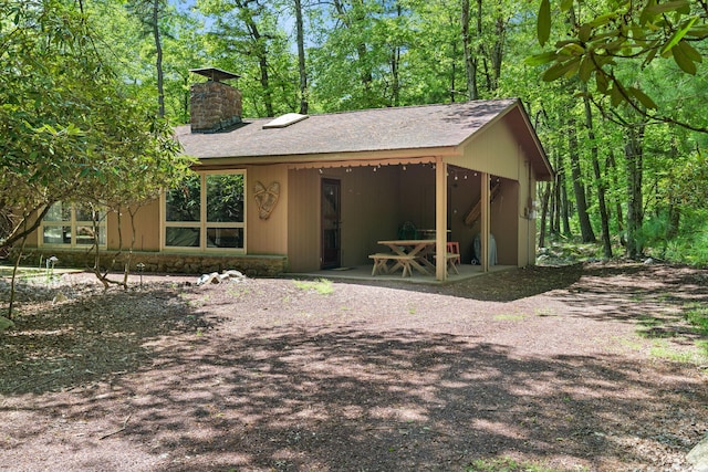 8 Big Boulder Rd, Lake Harmony, PA 18624 - view of front of house featuring a chimney and roof with shingles