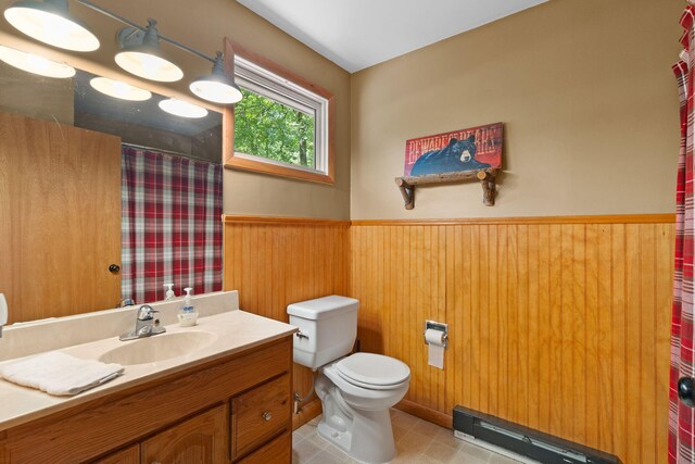 8 Big Boulder Rd, Lake Harmony, PA 18624 - bathroom featuring a wainscoted wall, vanity, toilet, baseboard heating, and a shower with shower curtain