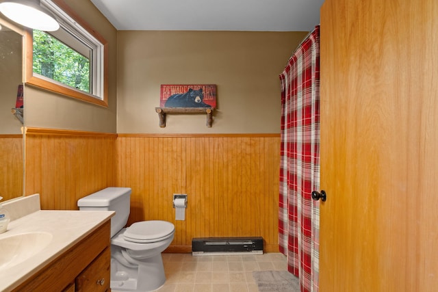 8 Big Boulder Rd, Lake Harmony, PA 18624 - bathroom with vanity, a wainscoted wall, toilet, wood walls, and baseboard heating