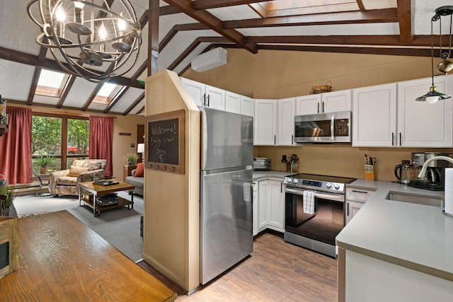 8 Big Boulder Rd, Lake Harmony, PA 18624 - kitchen featuring stainless steel appliances, a sink, beam ceiling, white cabinets, and a chandelier