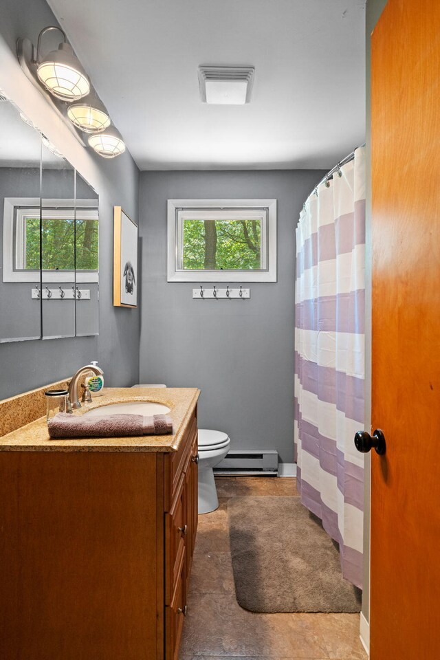 8 Big Boulder Rd, Lake Harmony, PA 18624 - full bathroom featuring a baseboard radiator, vanity, plenty of natural light, and toilet
