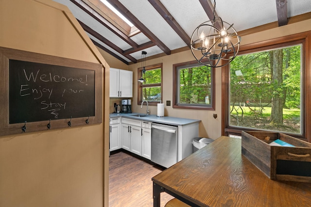 8 Big Boulder Rd, Lake Harmony, PA 18624 - kitchen featuring stainless steel dishwasher, white cabinetry, a skylight, and a chandelier