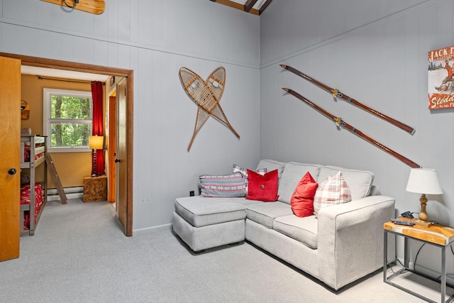 8 Big Boulder Rd, Lake Harmony, PA 18624 - carpeted living area featuring a baseboard heating unit and wooden walls