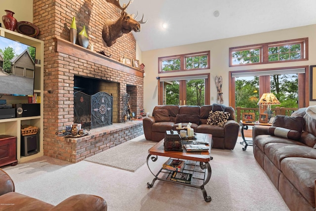 living room featuring a brick fireplace, high vaulted ceiling, and carpet flooring