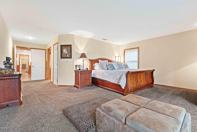 bedroom with carpet floors, visible vents, and baseboards