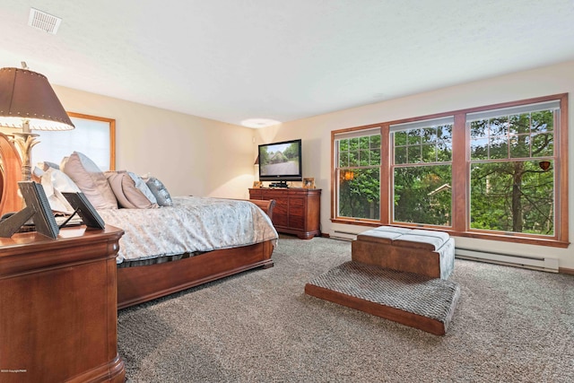 bedroom featuring carpet floors, baseboards, visible vents, and baseboard heating