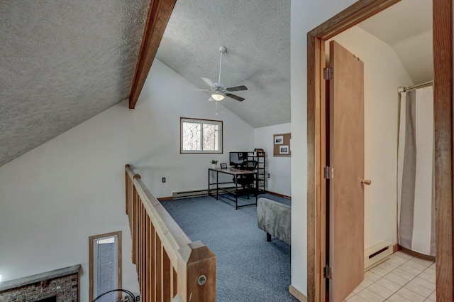 office space with ceiling fan, lofted ceiling, carpet, and a textured ceiling