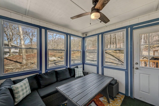 sunroom with a ceiling fan