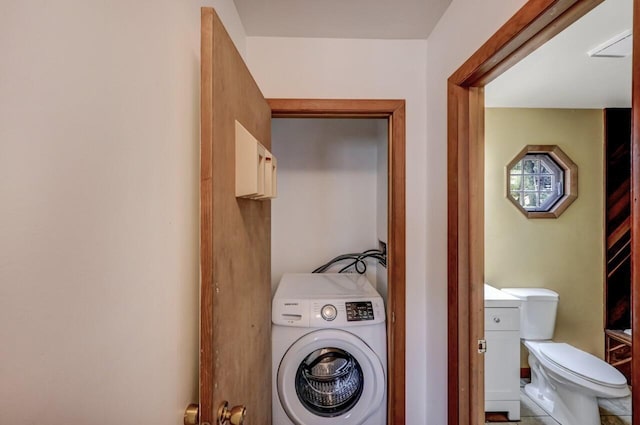 washroom with washer / dryer