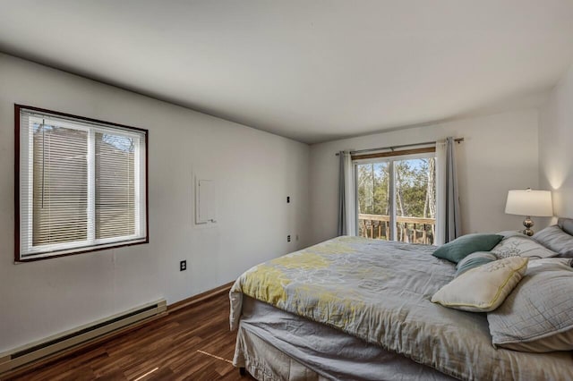 bedroom with baseboard heating, dark wood-style floors, and access to exterior