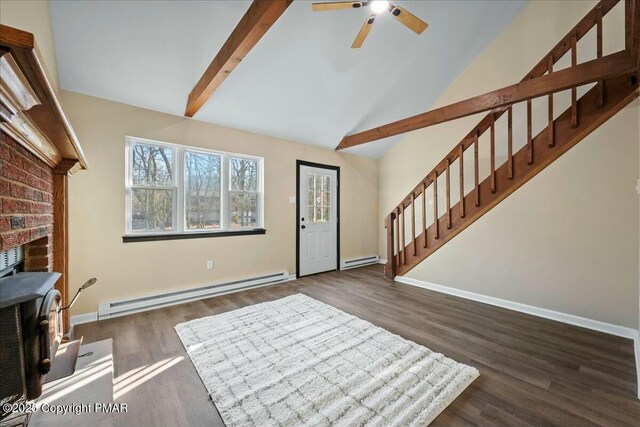 entrance foyer featuring dark wood-style flooring, baseboards, baseboard heating, and stairs