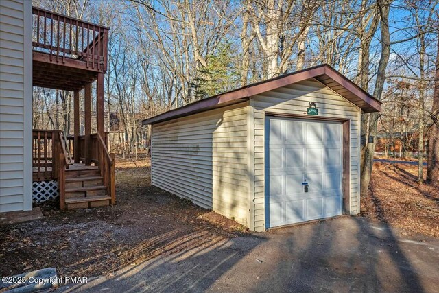 view of outbuilding featuring an outbuilding and driveway