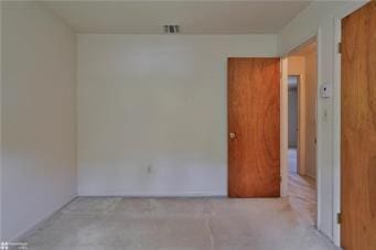 empty room featuring carpet flooring